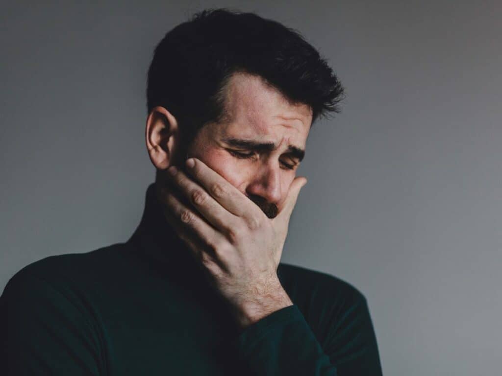 crying man taking lie detector test